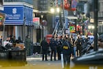 FBI investigators arrive at the scene where the white Ford F-150 pickup truck that crashed into a work lift after allegedly driving into a crowd of New Year's revelers in the French Quarter of New Orleans, Louisiana.
