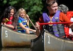 In this undated photo provided by Oregon Summer Star, campers paddle canoes on a summer day. The camp used to host about 200 children from military families each year, but now hosts about 50. The camp's goal is to provide community to children with military ties.