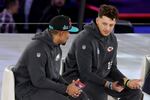 (L-R) Jalen Hurts #1 of the Philadelphia Eagles talks with Patrick Mahomes #15 of the Kansas City Chiefs during Super Bowl LVII Opening Night presented by Fast Twitch at Footprint Center on February 06, 2023 in Phoenix, Arizona.