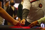 Over six dozen people attended the transfer of ownership event held on March 15, 2024. Each person placed a penny or two on a red prayer cloth until they added up to 100, or $1, the symbolic price of the former Presbyterian Church of Laurelhurst.