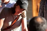 U.S. Rep. Marie Gluesenkamp Perez listens to a supporter at a bar in Vancouver, Wash. on Aug. 6, 2024. The incumbent is likely to rematch with Trump-backed Joe Kent this November to represent Southwest Washington's Congressional District.