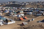 Displaced Palestinians take shelter in a makeshift tent camp by the beach in Rafah near the border with Egypt in the southern Gaza Strip on Tuesday, amid the ongoing conflict between Israel and the Palestinian militant group Hamas.