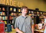 Tom Nissley smiles on the opening day of his Phinney Ridge shop, Phinney Books, in June 2014.