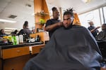 Cherita Evans aka Storm the Barber, with Christian Pounds in her chair at Head Changerz Barber Lounge in Rocky Mount, N.C. on May 23, 2024.