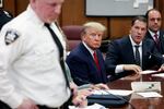 Former President Donald Trump sits in the courtroom with his attorneys Joe Tacopina and Boris Epshteyn (right) during his arraignment at the Manhattan Criminal Court on April 4 in New York City.