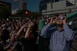 Eclipse watchers turn their heads to the sky during 99 percent totality.