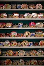 The "Ramen Wall" offers different types of instant ramen for store patrons to buy, prepare, and eat in the store. Tomi Mart worker Erika Morgan says the spicier flavors are often more popular.