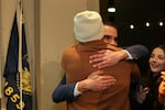 Anthony Broadman hugs friend Marcus LeGrand after news of his victory over Michael Summers is reported at the Deschutes Democrats election watch party in Bend, Ore., on Nov. 5, 2024.