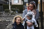 Coya Crispin with her son, Titan, and her daughter, Saraia in the courtyard of Titan Manor. The family recently received a no-fault eviction notice.  