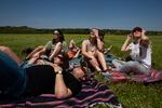 Marianna Davenport, Jada Trice, David Price, Brinson Davenport, Kassie Lamoureux, Landon Gardner, and Hannah Noble watch the eclipse in Searcy, Ark.