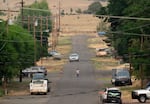 Kids play in the street in Fossil, Ore., as the area is blanketed in wildfire smoke.