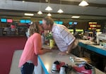 In this undated and provided photo, Rachael Allen and her husband, Don Allen, share a kiss at Interstate Lanes in Portland on the last day it was open to the public. Rachael and Don had first met at Interstate Lanes in 1977. The bowling center was owned by the Allen family for decades until its closure in 2016.