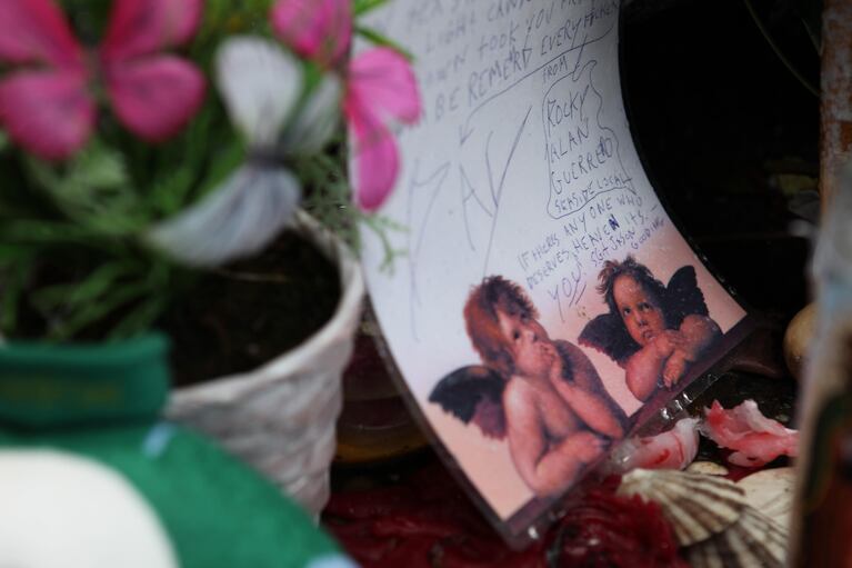 A sidewalk memorial for slain Seaside Police Sgt. Jason Goodding