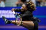 Serena Williams follows through on a shot to Ajla Tomljanovic during the third round of the U.S. Open tennis championships on Friday in New York.