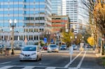 FILE - Vehicle traffic on the portion of Southwest 2nd Avenue between Harvey Milk Street and Washington Street in downtown Portland, Ore., on Nov. 27, 2023.