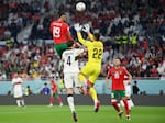 Youssef En-Nesyri of Morocco soars high to head the ball and score the team's first goal during Morocco-Portugal quarterfinal at the World Cup in Qatar on December 10, 2022.