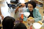 Nancy Golden watches two Earl Boyles Elementary School preschoolers.