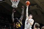 FILE - Oregon State forward Tyler Bilodeau (10) shoots as California forward Sam Alajiki (24) defends during the first half of an NCAA college basketball game in Corvallis, Ore., Saturday, March 4, 2023.