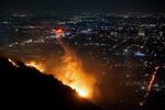 Wed., Jan. 8: Water is dropped by helicopter on the burning Sunset Fire in the Hollywood Hills section of Los Angeles on Wednesday.