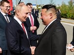 Russian President Vladimir Putin, left, and North Korea's leader Kim Jong Un shake hands during their meeting at the Vostochny cosmodrome outside the city of Tsiolkovsky, about 200 kilometers (125 miles) from the city of Blagoveshchensk in the far eastern Amur region, Russia, on Wednesday, Sept. 13, 2023.