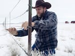 Ammon Bundy removes a fence separating the Malheur National Wildlife Refuge from ranching land.