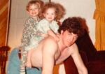 Kelli Jo Hammack and her brother, Johnny, ride on the back of their father, John Hammack. John, an accomplished rodeo rider and logger, was killed by a falling tree while working a forest fire in 2013.