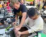 Pacific University students learn how to screen print shirts at a Pacific Votes voter engagement event on Oct. 11, 2024.