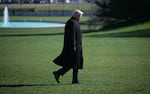 President Trump walks to the Oval Office at the White House in Washington, D.C., as he returns from Dover Air Force Base in Delaware after attending a dignified transfer solemn event on Wednesday.