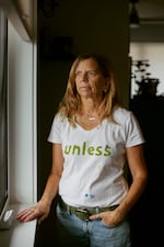 Daryl McCool poses inside her rebuilt home in Superior, Colorado. Her previous home was destroyed in the Marshall Fire, which swept through Superior and Louisville on Dec. 30, 2021. T