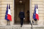French outgoing Prime Minister Sebastien Lecornu, who resigned just a day after naming his government, walks back after delivering his statement at the Hotel Matignon in Paris, Monday, Oct. 6, 2025.