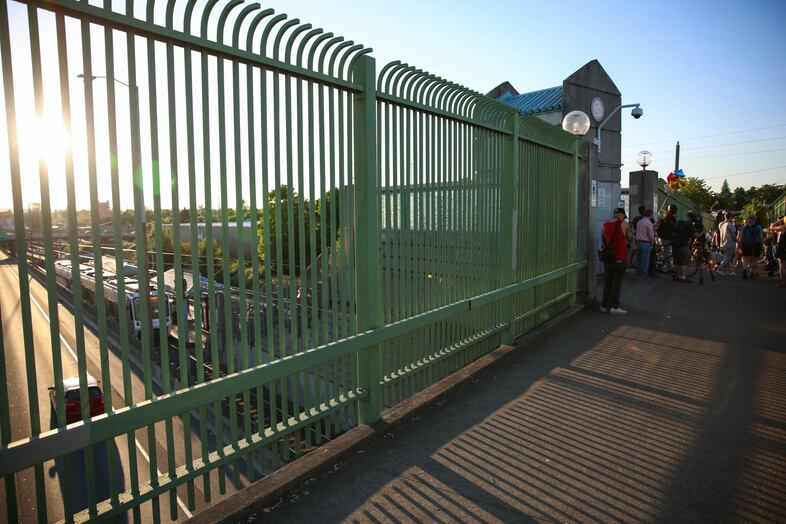 The bridge over the MAX tracks at the Hollywood Transit Center in Northeast Portland. Memorials to the victims sprouted on the bridge and at the street corner.