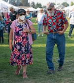 Some fairgoers wear masks on the opening day of the Crook County Fair in Prineville, Ore., on Aug. 5, 2026.