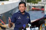 U.S. Coast Guard Captain Jo-Ann F. Burdian details the search of 38 missing migrants at a news conference, Wednesday, Jan. 26, 2022, in Miami Beach, Fla. One migrant was found clinging to the hull of an overturn vessel and one body was recovered off the coast of Fort Pierce, Fla. The migrants left the Bahamas on Saturday in what the Coast Guard suspects is a human smuggling operation.