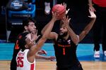 Oregon State forward Maurice Calloo (1) shoots on Houston forward Fabian White Jr. (35) during the first half of an Elite 8 game in the NCAA men's college basketball tournament at Lucas Oil Stadium, Monday, March 29, 2021, in Indianapolis. (AP Photo/Darron Cummings)