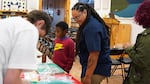 Visitors check out displayed artifacts from the Maxville archaeological project at Fishtrap nonprofit event space in Enterprise, Ore., Sept. 12, 2024.