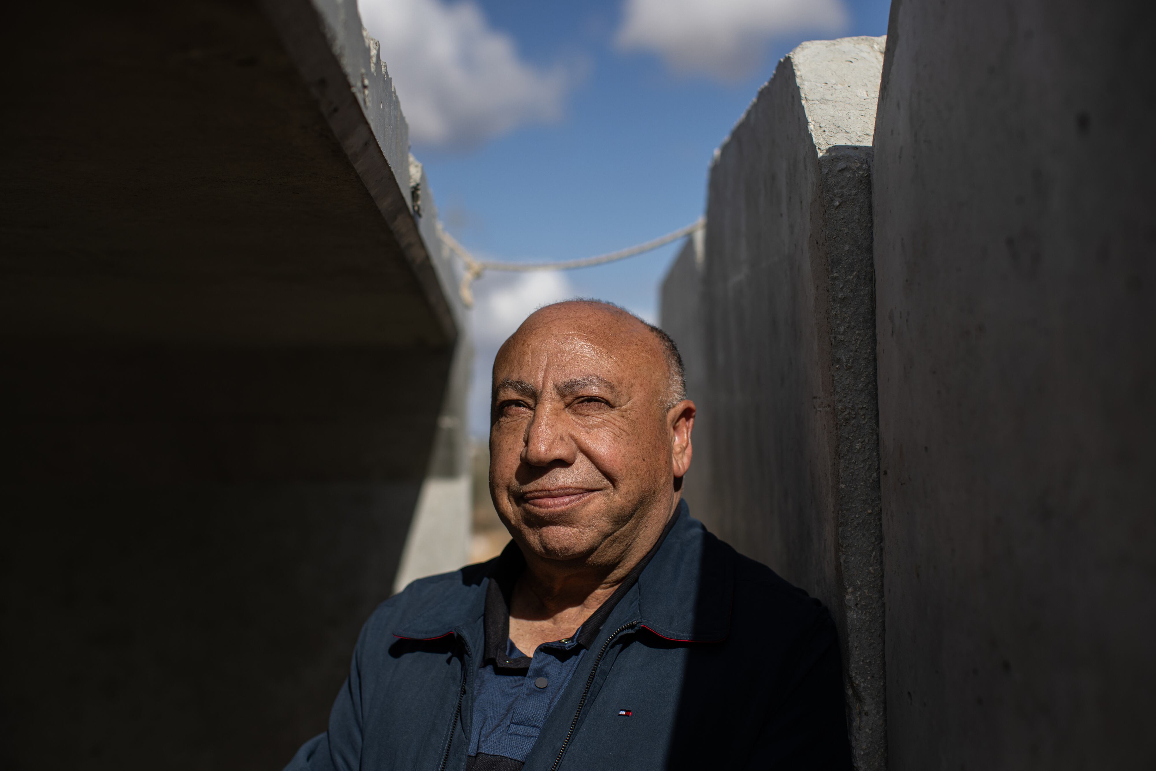 Kher Albaz, chairman of the board of AJEEC, an organization promoting Arab-Jewish equality and cooperation in the Negev Desert, stands in a concrete shelter in the unrecognized Bedouin village of Wadi al-Na'am in southern Israel.