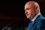Sen. Mark Kelly, D-Ariz., speaks during a news conference in Washington in July.