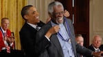 Then-President Barack Obama awards Russell with the Presidential Medal of Freedom at the White House in February 2011.