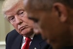 In this file photo from Nov. 10, 2016, then-President-elect Donald Trump listens to then-President Barack Obama speak after their Oval Office meeting.