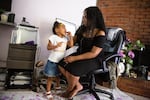 LaTasha Taylor asks her daughter Saniyah, 3, about her upcoming birthday party at their home Friday, June 19, 2020, in Portland, Ore.