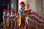Swiss Guards line up in front of St. Peter's Basilica at the Vatican, Wednesday, Dec. 25, 2024. (AP Photo/Andrew Medichini)