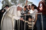 Pope Francis meets migrants at the Moria detention center near Mytilene on the Greek island of Lesbos on April 16, 2016.