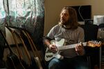 Bill Kowalcic in his music room. In his time off, he enjoys performing with his heavy new wave band Public Squares.