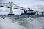 Predator, a trawling boat, passing under the Astoria-Megler Bridge near Astoria, Ore., Aug 11, 2024.