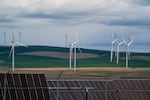 FILE - Windmills and solar panels in Umatilla County, Ore., on April 1, 2026.