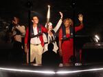 Rafael Nadal holds the Olympic torch alongside Serena Williams on a boat on the river Seine ahead of lighting the Olympic cauldron during the opening ceremony.