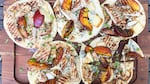 Flatbread pizzas topped with grilled peaches and chicken