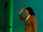 Vice President Harris waves as she leaves the stage after speaking to leaders during the COP28 U.N. Climate Summit on Dec. 2, 2023 in Dubai, United Arab Emirates.