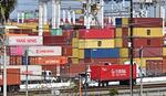 Shipping containers are stacked high at the Port of Long Beach in California on March 4.