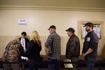 Opponents of Senate Bill 978 sign in before public testimony at the Capitol in Salem, Ore., Tuesday, April 2, 2019. An amendment to the bill before the Senate judiciary committee requires safe storage of firearms, allows retailers to refuse some gun sales and more.